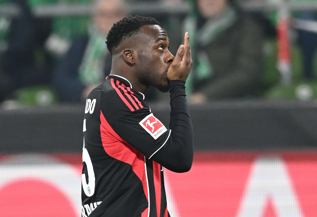 Frankfurt's Arnaud Kalimuendo-Muinga celebrates scoring during the Bundesliga soccer match between Werder Bremen and Eintracht Frankfurt in Bremen, Germany, Friday Jan. 16, 2026. (dpa via AP)
