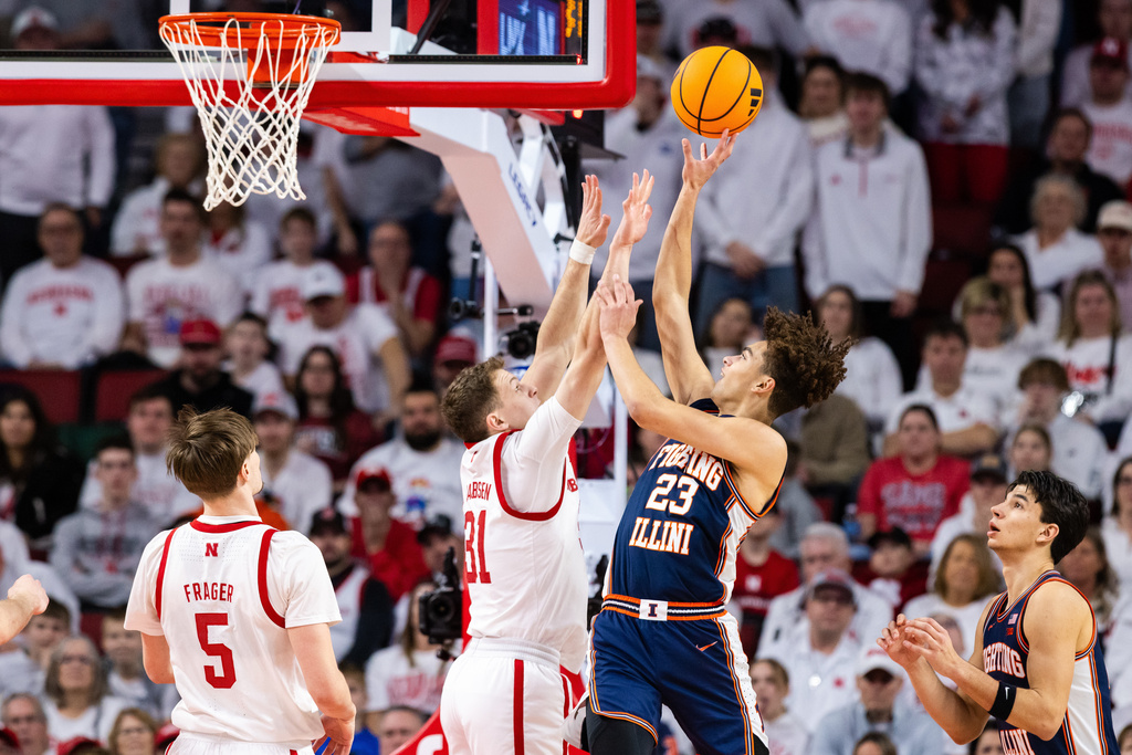 Illinois guard Keaton Wagler (23) shoots against Nebraska guard Cale Jacobsen (31) during the first half of an NCAA college basketball game, Sunday, Feb. 1, 2026, in Lincoln, Neb. (AP Photo/Bonnie Ryan)