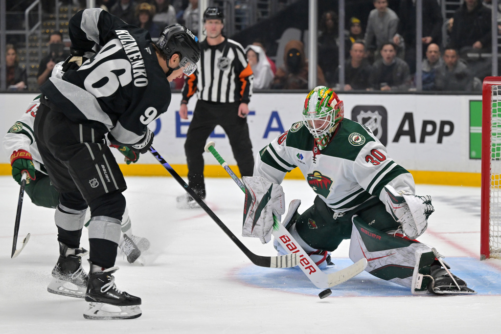 Minnesota Wild goaltender Jesper Wallstedt blocks a shot by Los Angeles Kings left wing Andrei Kuzmenko during the second period of an NHL hockey game, Saturday, Jan. 3, 2026, in Los Angeles. (AP Photo/Jayne Kamin-Oncea)