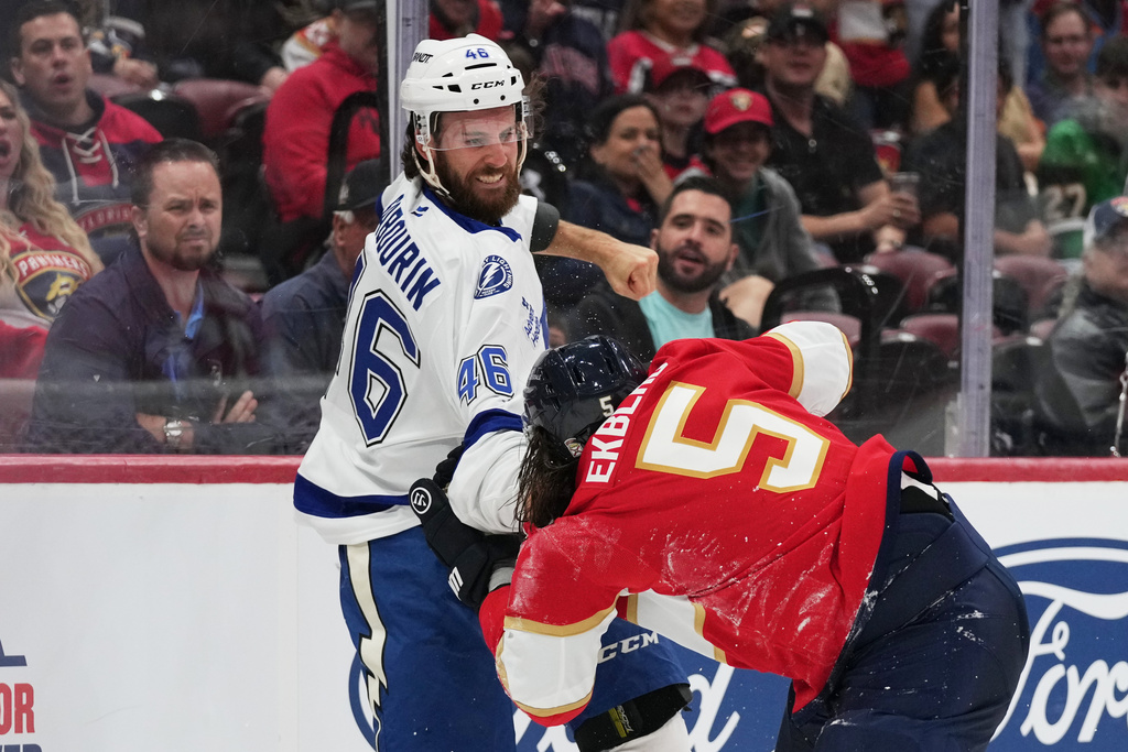 FILE - Tampa Bay Lightning right wing Scott Sabourin (46) and Florida Panthers defenseman Aaron Ekblad (5) trade blows during the first period of a preseason NHL hockey game, Saturday, Oct. 4, 2025, in Sunrise, Fla. (AP Photo/Lynne Sladky, File)
