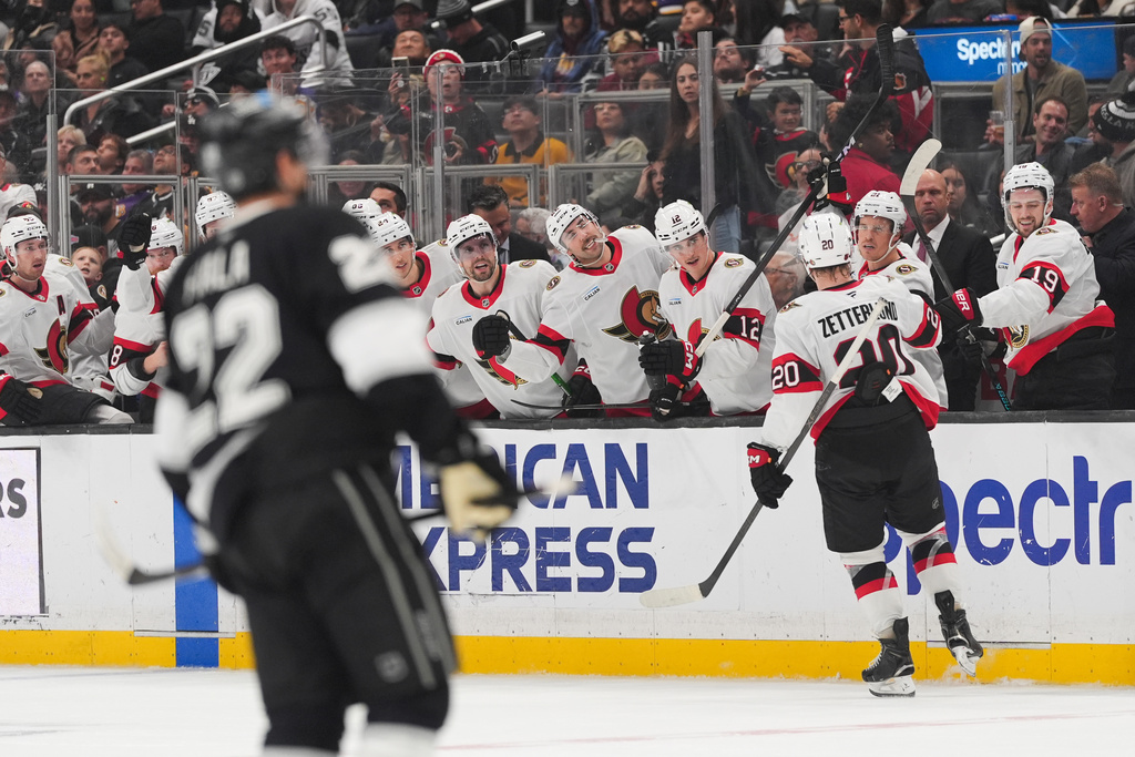 Ottawa Senators left wing Fabian Zetterlund (20) celebrates his goal with teammate during the third period of an NHL hockey game against the Los Angeles Kings Monday, Nov. 24, 2025, in Los Angeles. (AP Photo/Jae C. Hong)