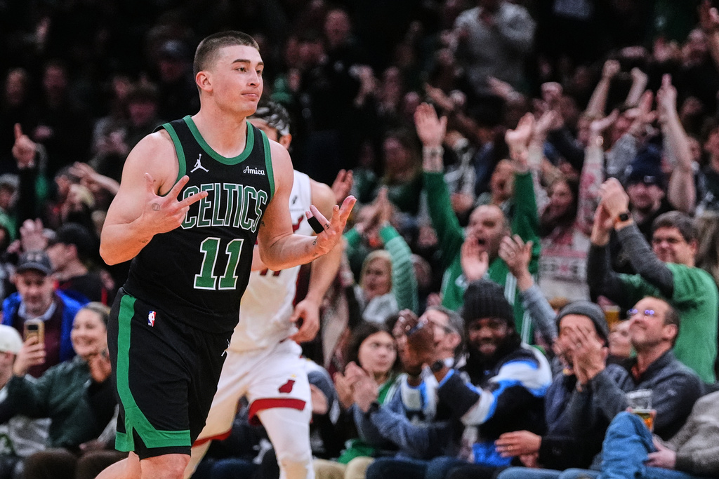 Boston Celtics guard Payton Pritchard (11) celebrates after hitting a 3-point basket during the second half of an NBA basketball game against the Miami Heat, Friday, Feb. 6, 2026, in Boston. (AP Photo/Charles Krupa)
