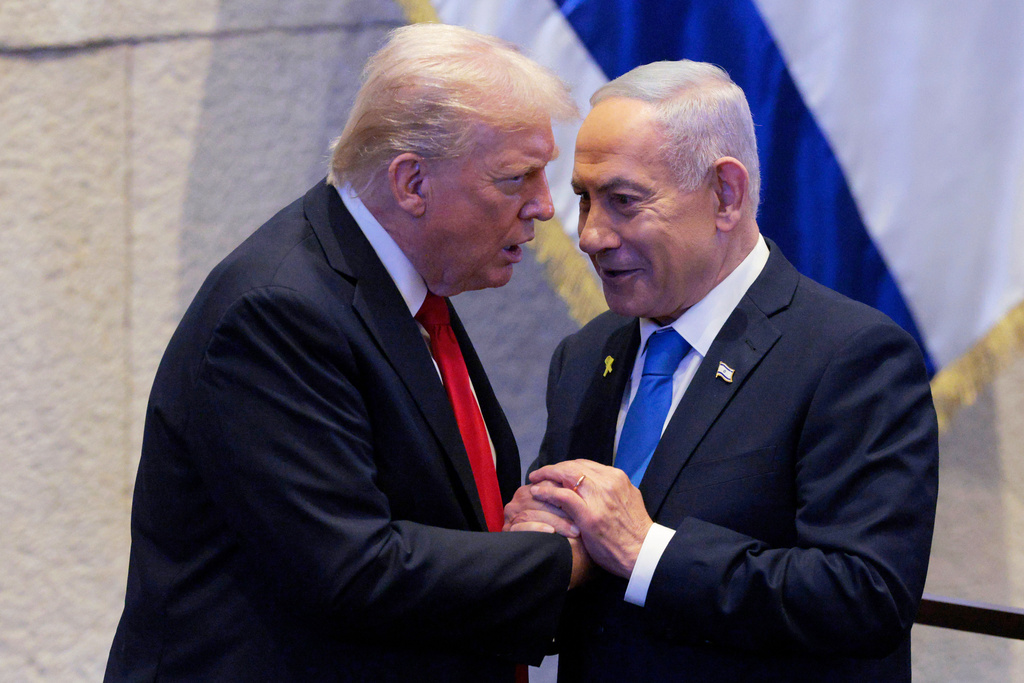 FILE - President Donald Trump talks with Israel's Prime Minister Benjamin Netanyahu at the Knesset, Israel's parliament, Monday, Oct. 13, 2025, in Jerusalem. (Chip Somodevilla/Pool via AP, file)