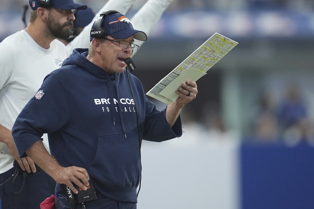 Denver Broncos head coach Sean Payton calls a play during the first half an NFL football game against the Indianapolis Colts, Sunday, Sept. 14, 2025, in Indianapolis. (AP Photo/Michael Conroy)