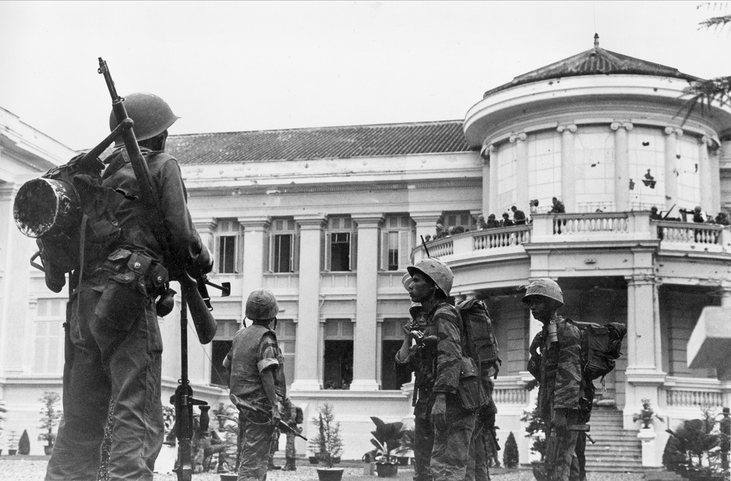 FILE - South Vietnamese rebel troops take up positions in the yard of the presidential palace, residence of President Ngo Dinh Diem, in Saigon, Vietnam, Nov. 1, 1963. Diem and his brother Nhu escaped the coup but were captured in the aftermath of the overthrow. (AP Photo/Horst Faas, File)