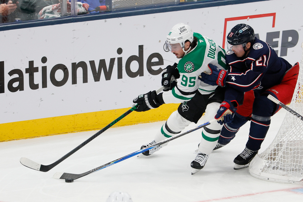 Dallas Stars' Matt Duchene, left, tries to skate past Columbus Blue Jackets' Isac Lundestrom during the third period of an NHL hockey game, Thursday, Jan. 22, 2026, in Columbus, Ohio. (AP Photo/Jay LaPrete)