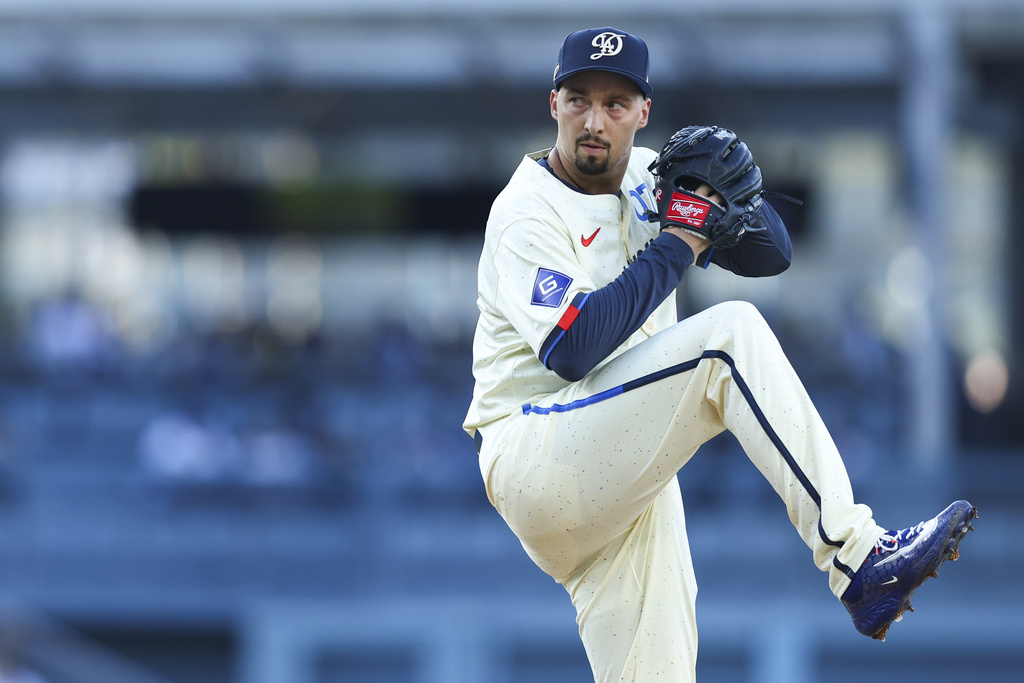 Los Angeles Dodgers pitcher Blake Snell prepares to throw to a Toronto Blue Jays batter during the first inning of a baseball game, Saturday, Aug. 9, 2025, in Los Angeles. (AP Photo/Jessie Alcheh)
