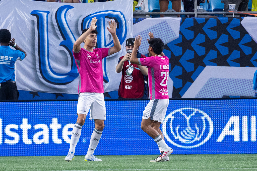Liga MX All-star Luis Rey (16) celebrates a goal with Jesus Gallardo (23) during the MLS All-Star soccer game Wednesday, July 29, 2026, in Charlotte, N.C. (AP Photo/Scott Kinser)