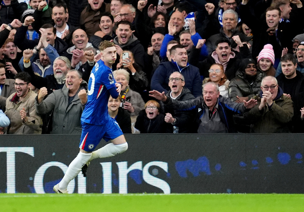 Chelsea's Cole Palmer celebrates after scoring his sides first goal during the English Premier League soccer match between Chelsea and Everton in London, Saturday, Dec. 13, 2025. (Adam Davy/PA via AP)