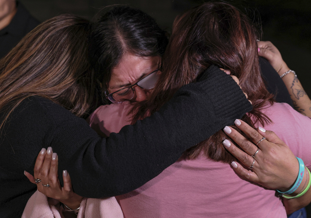 Mothers of Robb Elementary School shooting victims, from left, Sandra Torres, Veronica Luevanos, and Felicha Martinez cry together outside the Nueces County Courthouse on Wednesday, Jan. 21, 2026, in Corpus Christi, Texas, after former Uvalde school district police officer Adrian Gonzales was found not guilty. (Sam Owens/The San Antonio Express-News via AP, Pool)