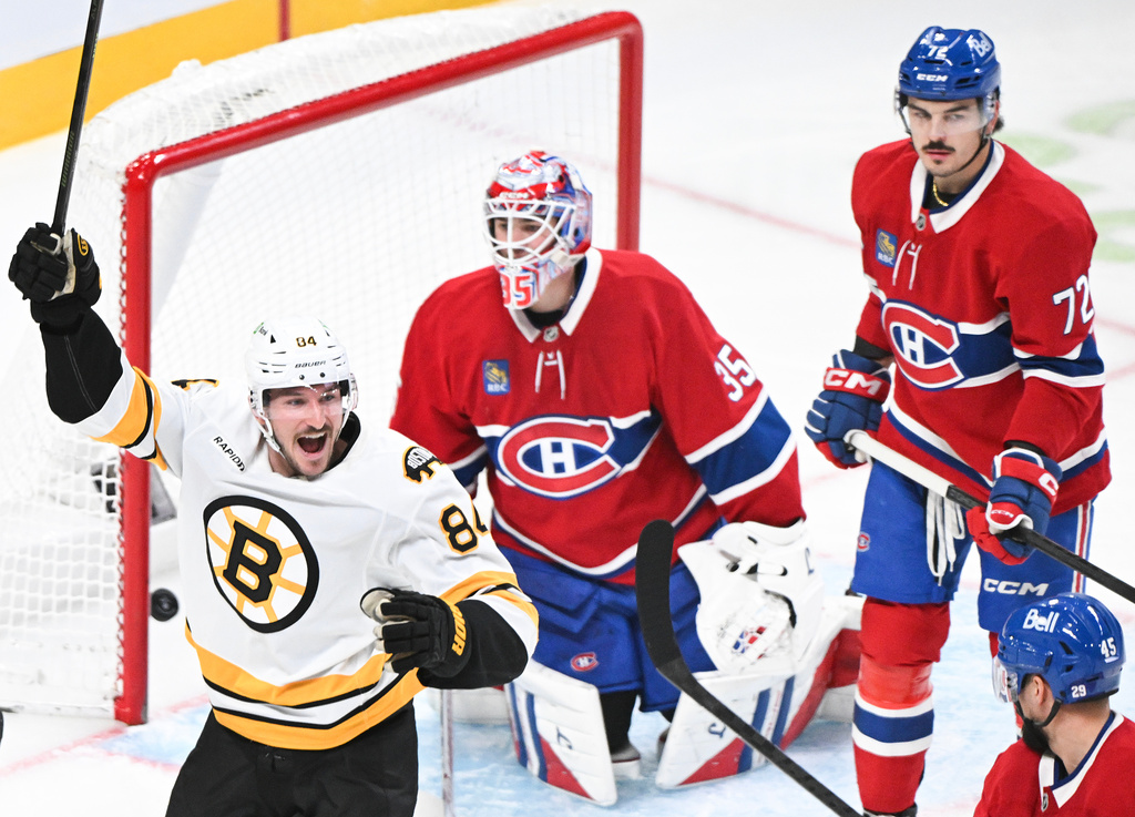 Montreal Canadiens goaltender Sam Montembeault (35) and Arber Xhekaj (72) look on as Boston Bruins' Tanner Jeannot (84) celebrates a goal by teammate Mason Lohrei during second period NHL hockey action in Montreal, Saturday, Nov. 15, 2025. (Graham Hughes/The Canadian Press via AP)