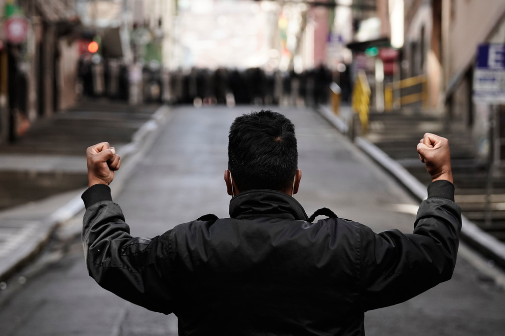 A protester faces the police during an anti-government protest in La Paz, Bolivia, Monday, May 18, 2026. (AP Photo/Freddy Barragan)