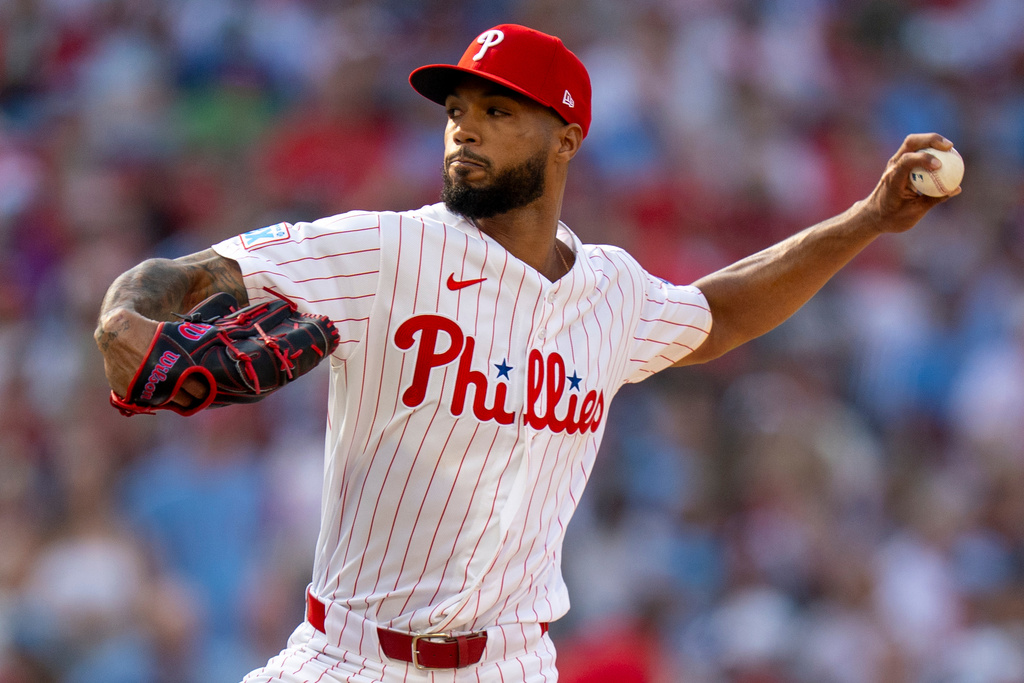 Philadelphia Phillies stating pitcher Cristopher Sanchez delvers during the first inning of an opening-day baseball game against the Texas Rangers, Thursday, March 26, 2026, in Philadelphia. (AP Photo/Chris Szagola)