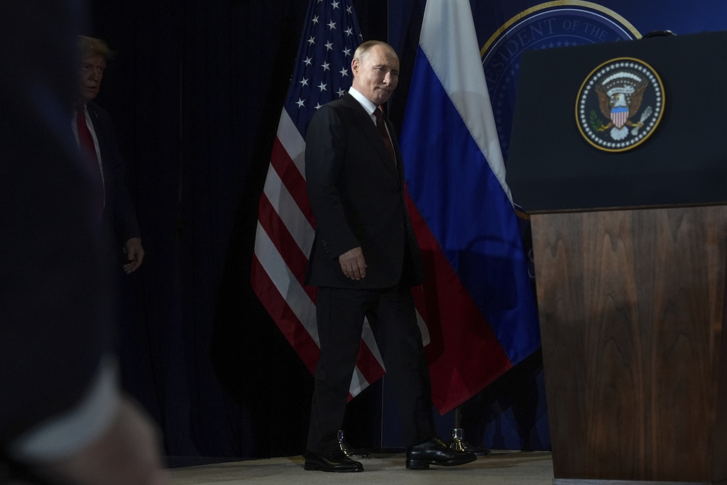 President Donald Trump, left, and Russia's President Vladimir Putin arrive for a press conference at Joint Base Elmendorf- Richardson, Friday, Aug. 15, 2025, in Anchorage, Alaska. (AP Photo/Julia Demaree Nikhinson)