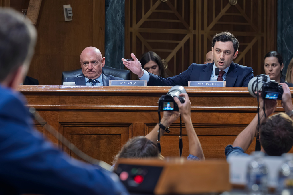 Sen. Jon Ossoff, D-Ga., joined at left by Sen. Mark Kelly, D-Ariz., questions Jay Clayton, President Donald Trump's pick to head the nation's intelligence agencies, as he appears for his confirmation hearing before the Senate Intelligence Committee, at the Capitol in Washington, Wednesday, July 15, 2026. (AP Photo/J. Scott Applewhite)