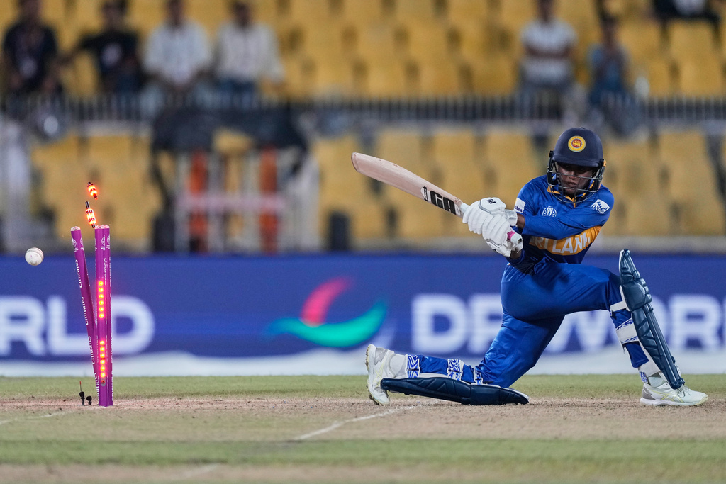 Sri Lanka's Sugandika Kumari bowled by India's Sneh Rana during the ICC Women's Cricket World Cup match between India and Sri Lanka at Barsapara Cricket Stadium in Guwahati, India, Tuesday, Sept. 30, 2025. (AP Photo/Anupam Nath)