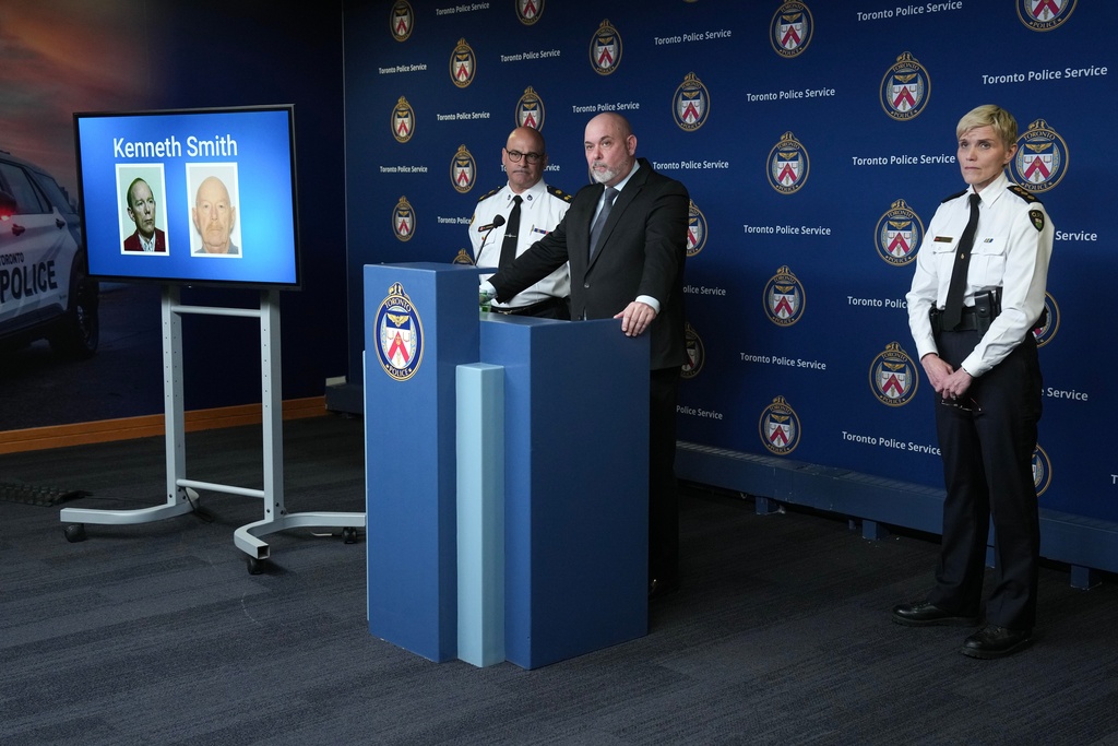 Detective Sergeant Steve Smith of the Cold Case Unit, center, Deputy Chief Rob Johnson, left, and Chief Superintendent Karen Gonneau of the Ontario Provincial Police provide a development in three historical homicide investigations, Thursday, Dec. 11, 2025, during a news conference at police headquarters in Toronto. (Chris Young/The Canadian Press via AP)