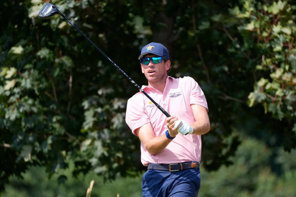 Ben Kohles reacts to his shot on the 16th hole during the first round of the 3M Open golf tournament at the Tournament Players Club Thursday, July 23, 2026, in Blaine, Minn. (AP Photo/Bruce Kluckhohn)