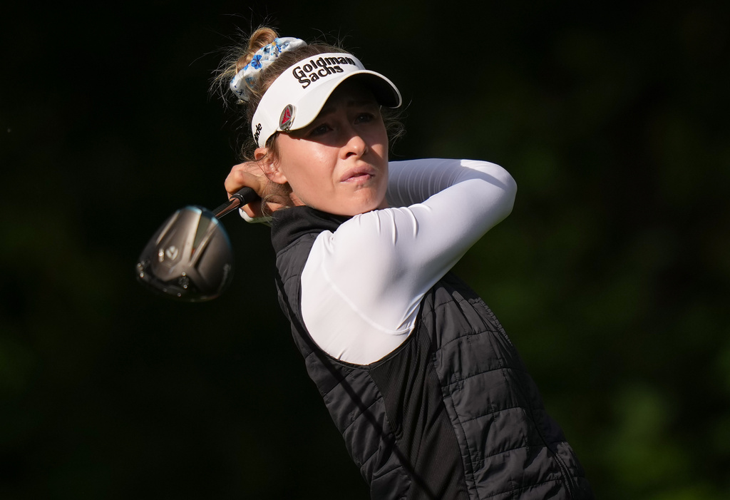 Nelly Korda, of the United States, watches her tee shot on the 14th hole during the first round at the LPGA Canadian Women's Open golf tournament in Edmonton, Alberta, Thursday, Aug. 20, 2026. (Darryl Dyck/The Canadian Press via AP)
