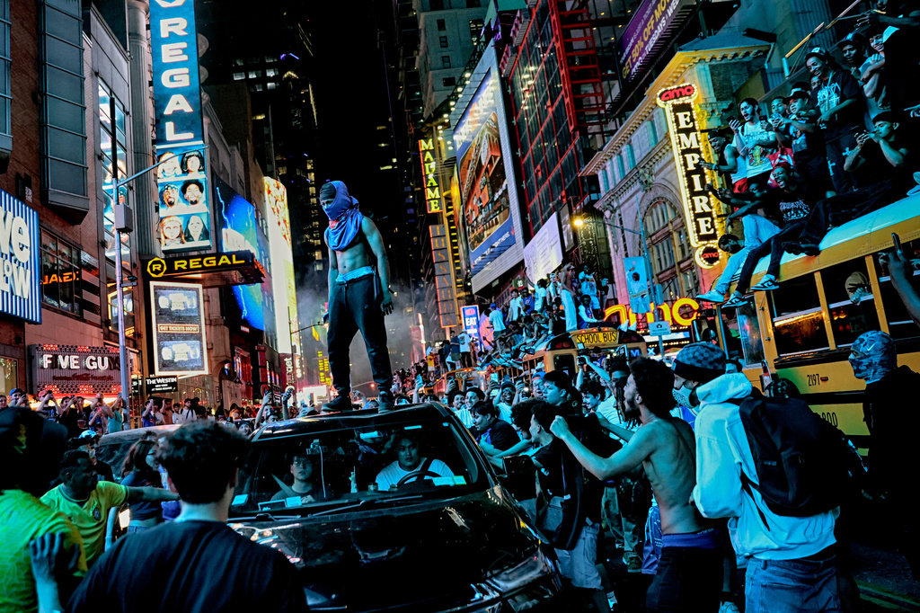 New York Knicks fans celebrate their victory after Game 5 of the NBA Finals basketball series against the San Antonio Spurs, Saturday, June 13, 2026, in New York. (AP Photo/Heather Khalifa)