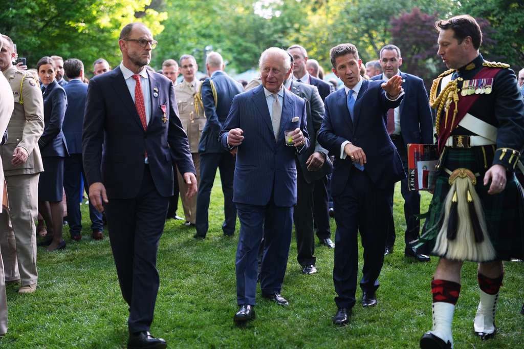 Britain's King Charles III and British Ambassador to the U.S. Christian Turner, right, attend a garden party at the British Embassy, Monday, April 27, 2026, in Washington. (AP Photo/Julia Demaree Nikhinson, Pool)