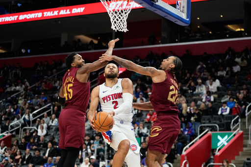 Detroit Pistons guard Cade Cunningham, center, shoots against Cleveland Cavaliers guards Donovan Mitchell, left, and Jaylon Tyson during the first half of an NBA basketball game, Monday, Oct. 27, 2025, in Detroit. (AP Photo/Ryan Sun) Detroit Pistons guard Cade Cunningham, center, shoots against Cleveland Cavaliers guards Donovan Mitchell, left, and Jaylon Tyson during the first half of an NBA basketball game, Monday, Oct. 27, 2025, in Detroit. (AP Photo/Ryan Sun)