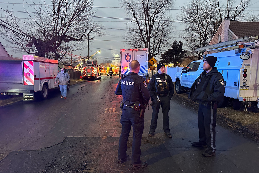 CORRECTS NAME OF FACILITY - First responders gather at the scene of an explosion at Bristol Health & Rehab Center in Bristol Township, Pa., Tuesday, Dec. 23, 2025. (AP Photo/Tassanee Vejpongsa)