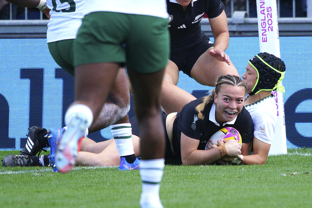 New Zealand's Renee Holmes scores her side's third try of the game during the Women's Rugby World Cup 2025 quarterfinal match between New Zealand and South Africa, in Exeter, England, Saturday, Sept. 13, 2025. (Ben Birchall/PA via AP)
