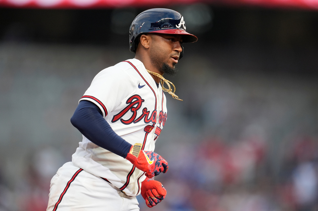 Atlanta Braves' Ozzie Albies (1) celebrates his solo homer against the Kansas City Royals during the first inning of an opening-day baseball game, Friday, March 27, 2026, in Atlanta. (AP Photo/Mike Stewart)