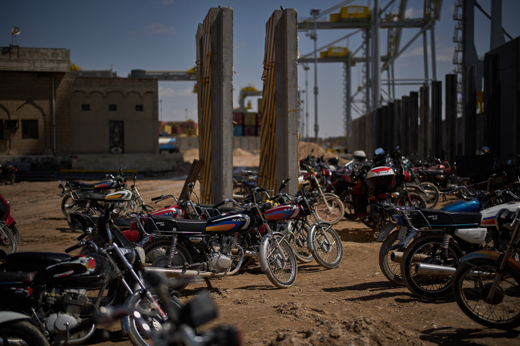 Motorcycles that belong to port workers are parked in an area at Umm Qasr Port, a deep-water port, in the city of Umm Qasr, Iraq, Friday, March 27, 2026. (AP Photo/Leo Correa)