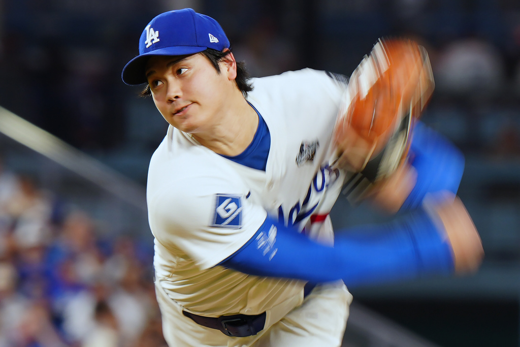 Los Angeles Dodgers pitcher Shohei Ohtani (17) delivers a pitch against the Toronto Blue Jays during fourth inning Game 4 World Series playoff MLB baseball action in Los Angeles on Tuesday, Oct. 28, 2025. (Frank Gunn/The Canadian Press via AP)