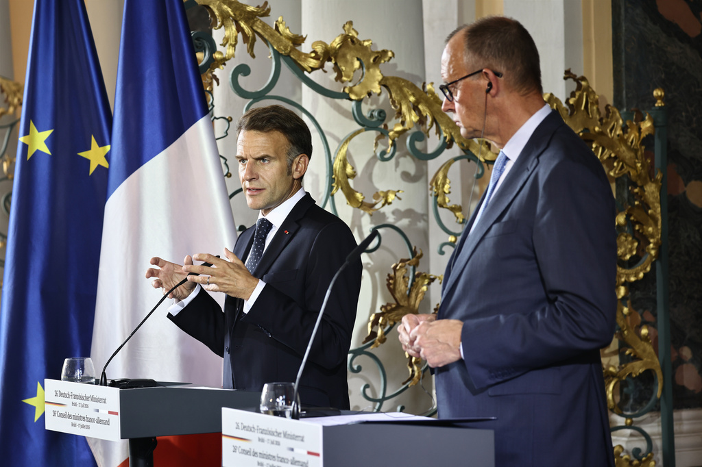 German Chancellor Friedrich Merz and French President Emmanuel Macron hold a press conference following a meeting of the Franco-German Ministerial Council in Brühl, Germany, Friday, July 17, 2026. (Oliver Berg/dpa via AP)