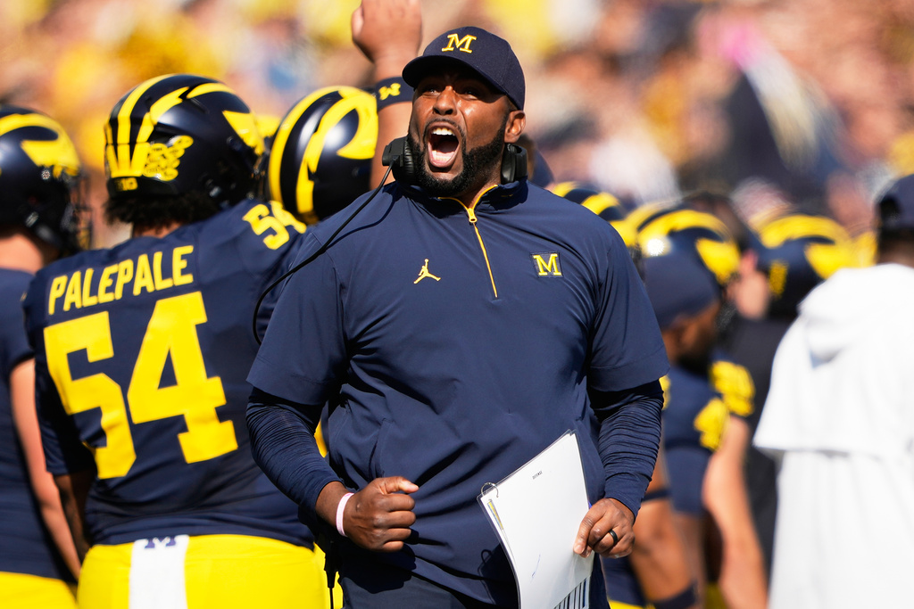 Michigan head coach Sherrone Moore reacts on the sideline during the first half of an NCAA college football game against Washington, Saturday, Oct. 18, 2025, in Ann Arbor, Mich. (AP Photo/Ryan Sun)