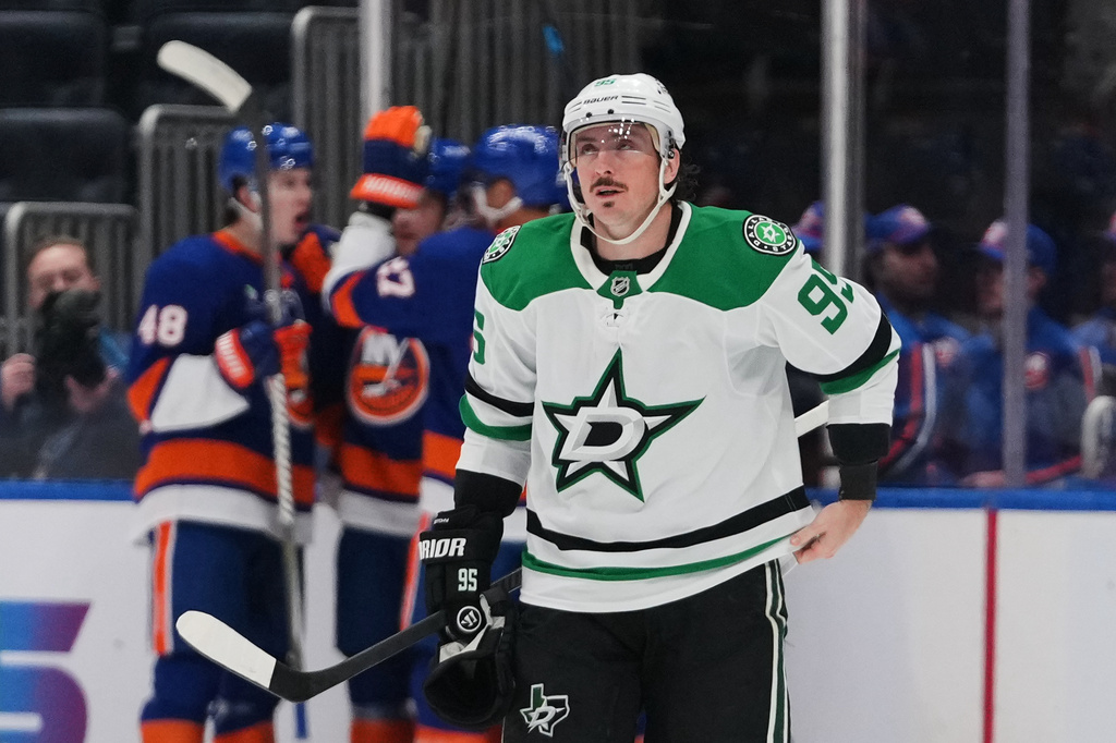 Dallas Stars' Matt Duchene (95) reacts as the New York Islanders celebrate a goal by Bo Horvat during the first period of an NHL hockey game Thursday, March 26, 2026, in Elmont, N.Y. (AP Photo/Frank Franklin II)