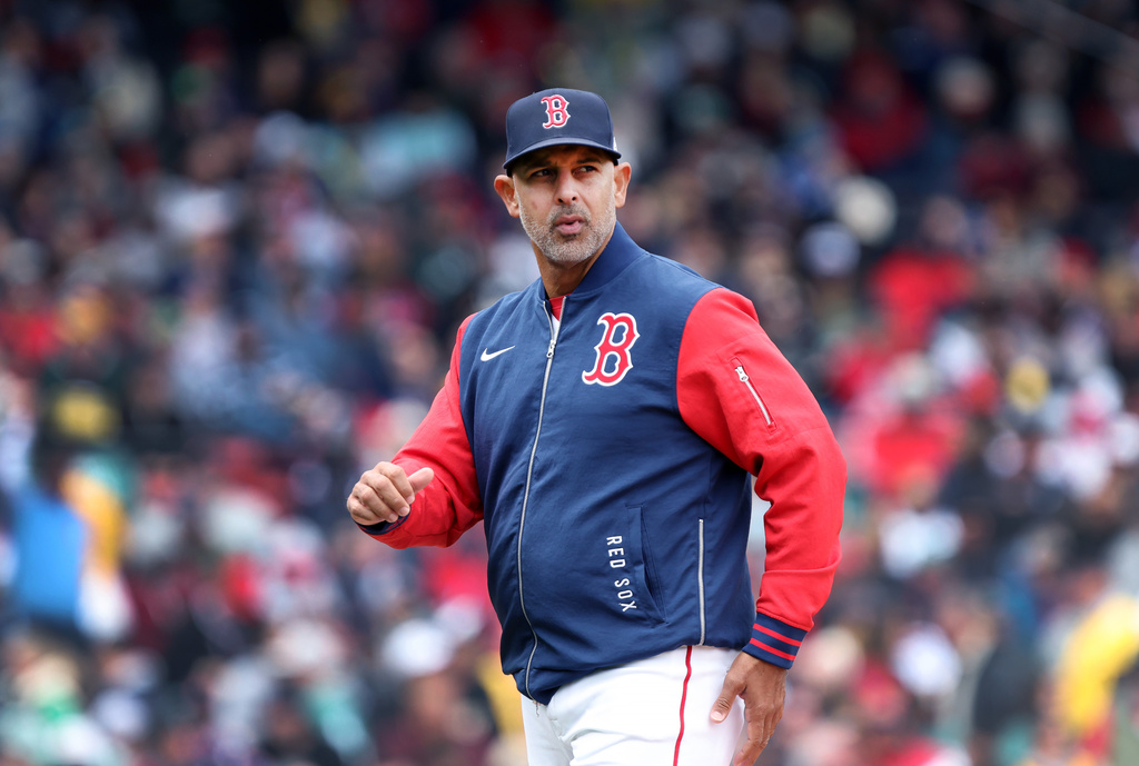 Boston Red Sox' manager Alex Cora walks back to the dugout after a mound visit during a baseball game against the Detroit Tigers, Monday, April 20, 2026, in Boston. (AP Photo/Jim Davis)