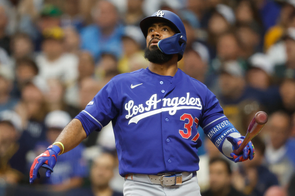 Los Angeles Dodgers' Teoscar Hernández watches his three-run home run during the fourth inning of a baseball game against the Milwaukee Brewers, Saturday, May 23, 2026, in Milwaukee. (AP Photo/Jeffrey Phelps)