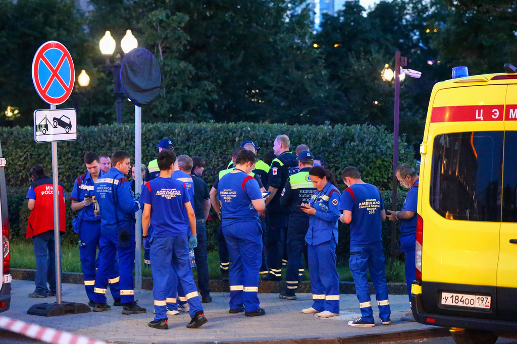 Paramedics gather near a deadly explosion at a restaurant in Moscow, Saturday, Aug. 1, 2026. (Sergei Vedyashkin/Moscow News Agency via AP)