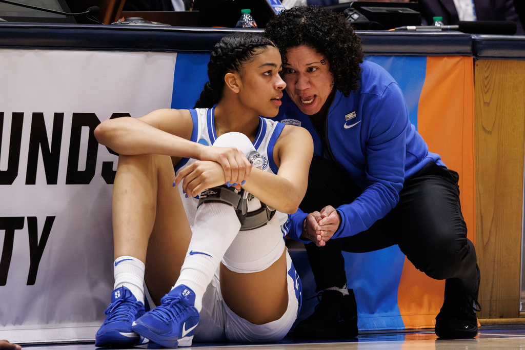Duke head coach Kara Lawson, right, speaks to player Arianna Roberson, left, during the first half against Baylor in the second round of the NCAA college basketball tournament, Sunday, March 22, 2026 in Durham, N.C. (AP Photo/Ben McKeown)