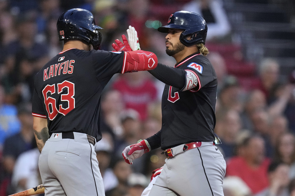 Cleveland Guardians' Gabriel Arias, right, is congratulated by C.J. Kayfus (63) after his two-run home run in the second inning of a baseball game against the Boston Red Sox at Fenway Park, Wednesday, Sept. 3, 2025, in Boston. (AP Photo/Charles Krupa)