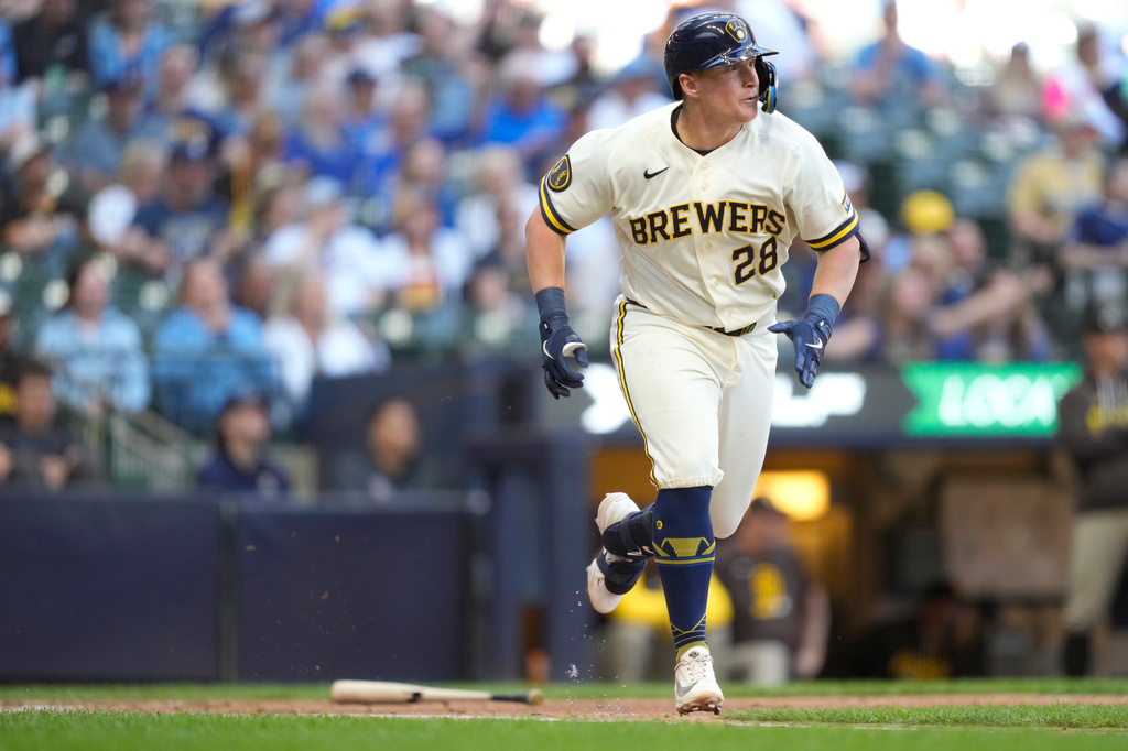 Milwaukee Brewers' Andrew Vaughn runs down the first base line after hitting a double during the fourth inning of a baseball game against the San Diego Padres, Thursday, May 14, 2026, in Milwaukee. (AP Photo/Kayla Wolf)
