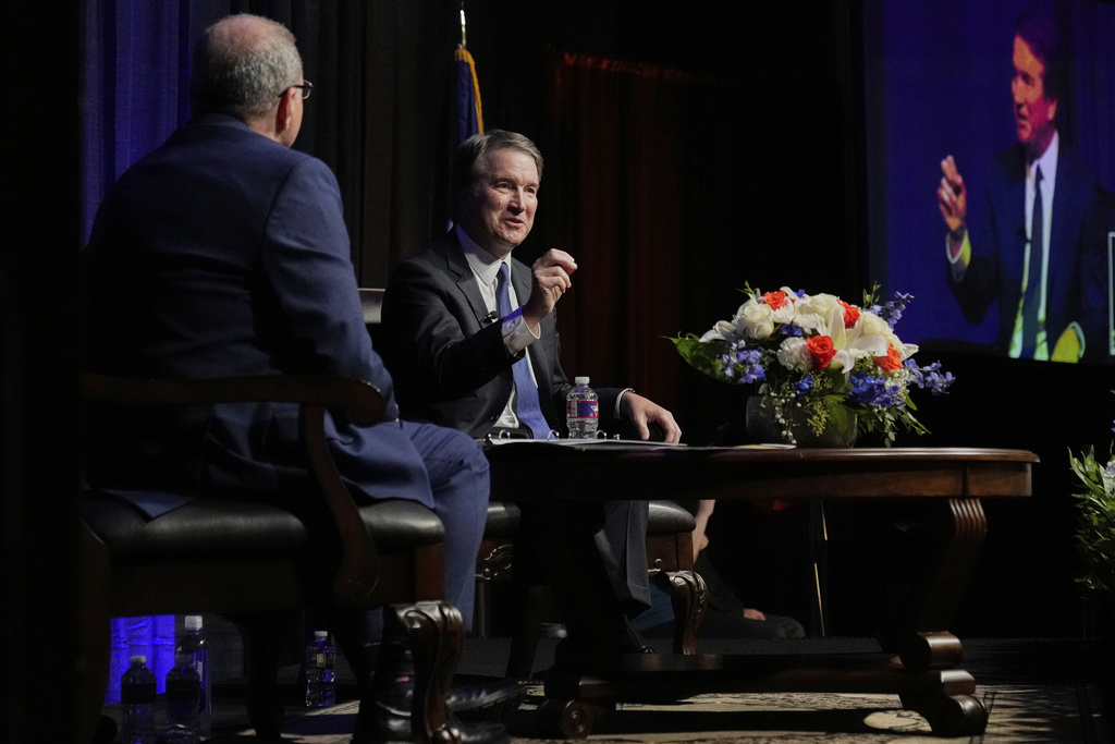 Justice Brett Kavanaugh, center right, responds to a question from Ashley Cruseturner, left, a history professor at McLennan Community College during The Ken Starr Lecture at the college, Thursday, Sept. 11, 2025, in Waco, Texas. (AP Photo/Tony Gutierrez)