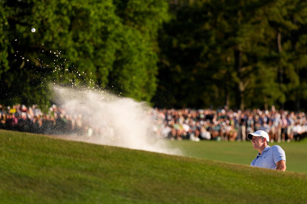 Rory McIlroy, of Northern Ireland, hits from the bunker on the 18th hole during the final round of the Masters golf tournament at the Augusta National Golf Club, Sunday, April 12, 2026, in Augusta, Ga. (AP Photo/Matt Slocum)