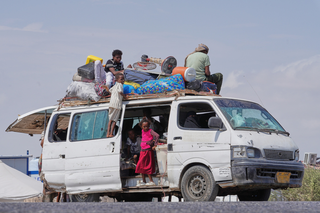 Members of the Haj Ali Araj family, who displaced from Mokha, arrive at Al-Firdaws camp in Ras Imran, on the western outskirts of Aden, Yemen, Thursday, Sept. 24, 2026. (AP Photo/Abdulnasser Alseddik)