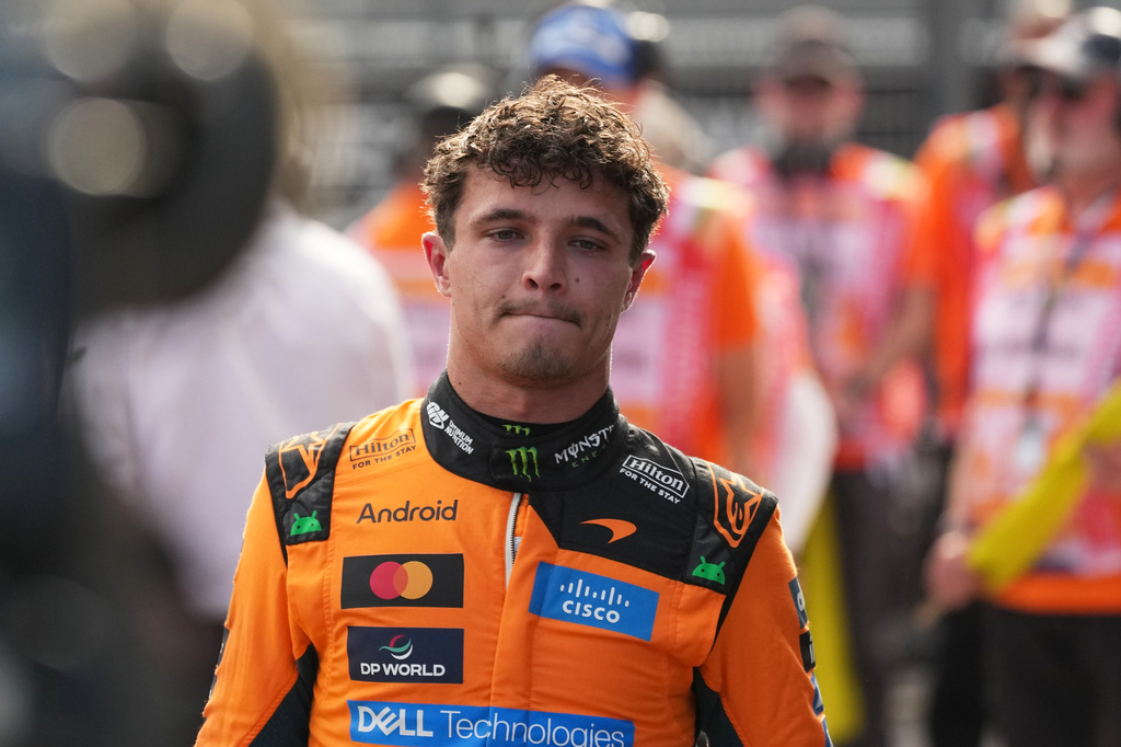McLaren driver Lando Norris of Britain walks after winning the qualifying session ahead of Sunday's Formula One Hungarian Grand Prix auto race, at the Hungaroring racetrack in Mogyorod, near Budapest, Hungary, Saturday, July 25, 2026. (AP Photo/Darko Vojinovic)