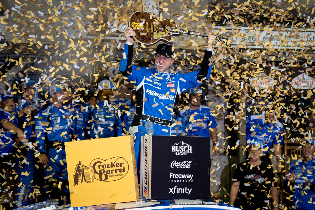 Denny Hamlin celebrates after winning a NASCAR Cup Series auto race, Sunday, May 31, 2026, in Lebanon, Tenn. (AP Photo/Camden Hall)