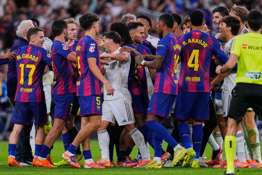 Real Madrid and Barcelona players scuffle during the Spanish La Liga soccer match between Real Madrid and Barcelona, in Madrid, Sunday, Oct. 26, 2025. (AP Photo/Manu Fernandez) Real Madrid and Barcelona players scuffle during the Spanish La Liga soccer match between Real Madrid and Barcelona, in Madrid, Sunday, Oct. 26, 2025. (AP Photo/Manu Fernandez)
