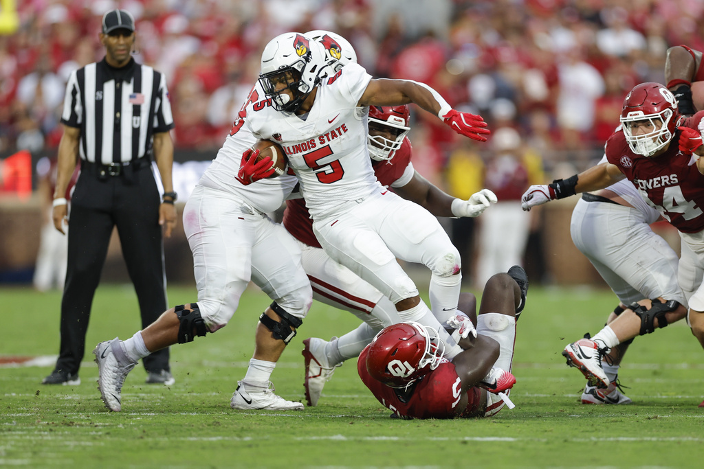 Oklahoma linebacker Kip Lewis (10) tackles Illinois State running back Victor Dawson (5) on a play during the first half of an NCAA college football game, Saturday, Aug. 30, 2025, in Norman, Okla. (AP Photo/Alonzo Adams)