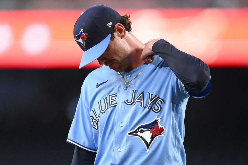 Toronto Blue Jays pitcher Shane Bieber walks back to the dugout after he was pulled from a baseball game in the first inning against the Washington Nationals, Tuesday, July 28, 2026, in Washington. (AP Photo/Nick Wass)