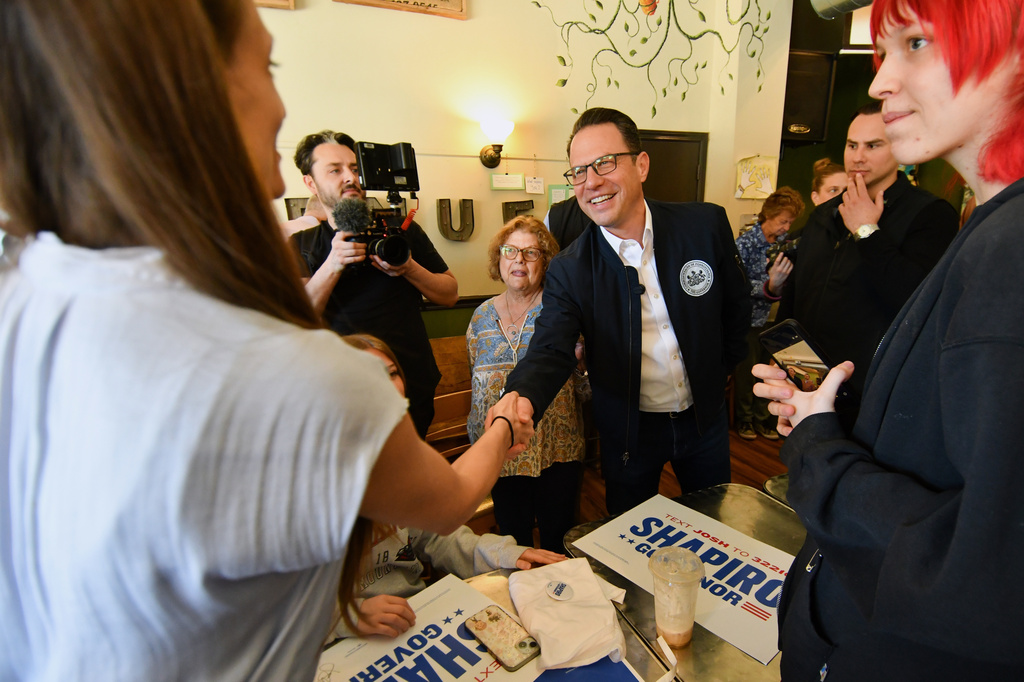 FILE - Pennsylvania Gov. Josh Shapiro greets members of the crowd after speaking at a Clinton County Democratic Party event at the Avenue 209 coffee shop, April 11, 2026, in Lock Haven, Pa. (AP Photo/Marc Levy, File)