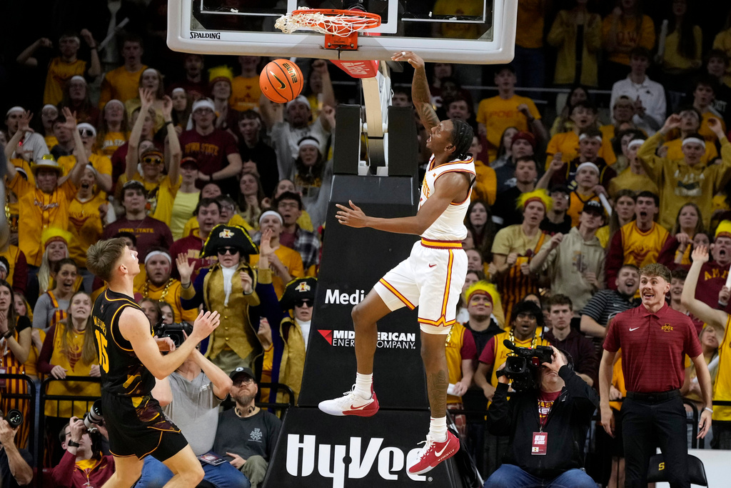 Iowa State guard Jamarion Batemon, right, dunks the ball over Arizona State guard Noah Meeusen (15) during the first half of an NCAA college basketball game, Saturday, March 7, 2026, in Ames, Iowa. (AP Photo/Charlie Neibergall)
